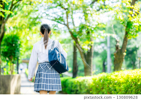 School girls with school bags 130809628