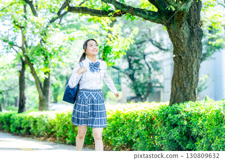 School girls with school bags 130809632