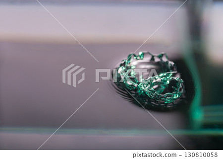 269.Green water drop crown on a dark surface 269.Green water drop crown on a dark surface 130810058