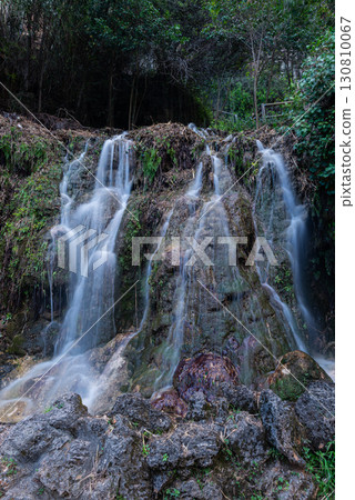 Soft Flowing Water Over Mossy Terraced Rock 130810067