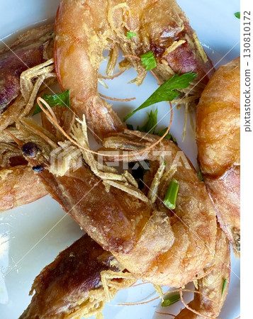 Close-up of crispy fried shrimp dish. Healthy seafood cooked at home. 130810172