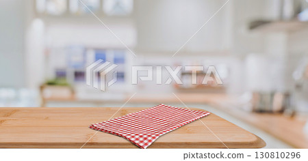 Empty wooden countertop with checkered napkin in modern kitchen 130810296