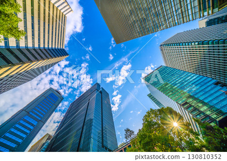 Tokyo cityscape in Japan. A sudden thunderstorm passes through the Otemachi business district. A view of buildings such as Otemachi Place. (8th) 130810352