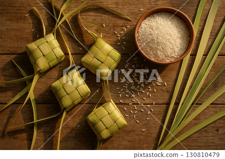 Ketupat placed on banana leaves representing natural cultural festive design 130810479