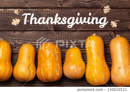 Festive arrangement of pumpkins for Thanksgiving celebration on wooden background 130810521