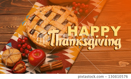 Celebrating Thanksgiving with a festive pie and autumn decorations on a wooden table 130810576