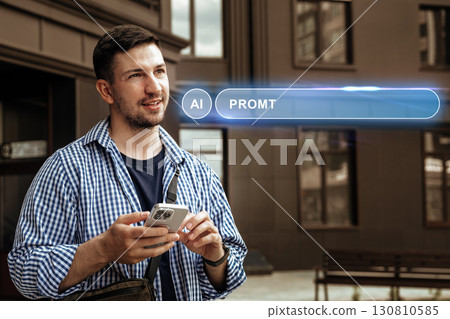 Man using smartphone with futuristic AI interface in urban setting during daylight hours 130810585
