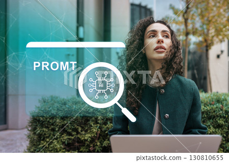 Woman exploring artificial intelligence concepts outdoors while using a laptop in a modern urban area during daytime 130810655