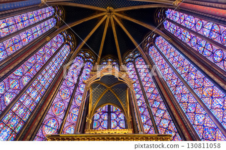 Stained glass windows in Sainte-Chapelle highlight Parisian Gothic architecture 130811058