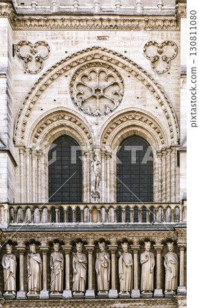 Detailed architectural features of Notre Dame Cathedral facade in Paris Detailed architectural features of Notre Dame Cathedral facade in Paris 130811080