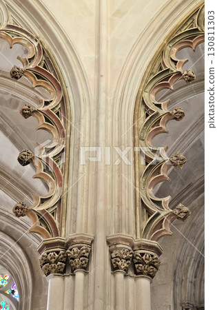 Intricate Gothic architecture of Batalha Monastery in Portugal showcasing unique detail Intricate Gothic architecture of Batalha Monastery in Portugal showcasing unique detail 130811303