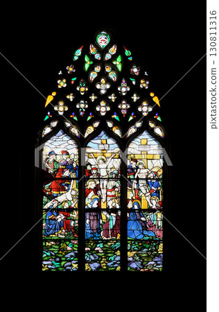 Batalha, Portugal - April 02, 2017 - Batalha Monastery's stained glass windows with rich colors and intricate designs 130811316