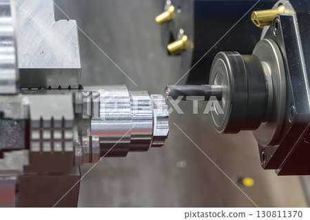 The CNC lathe machine milling process on metal shaft parts by flat nose end mill tool. 130811370