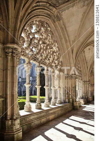 Intricate stone arches and columns in the beautiful cloister at Batalha monastery Intricate stone arches and columns in the beautiful cloister at Batalha monastery 130811641