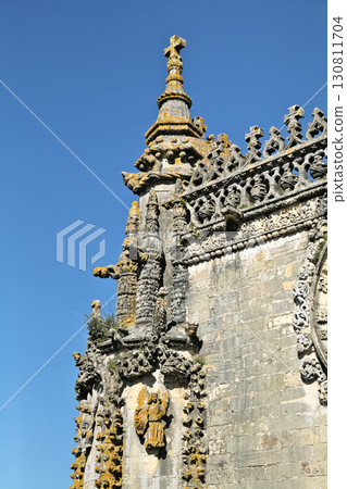 Architectural details of Convento de Cristo in Tomar, Portugal on a clear day Architectural details of Convento de Cristo in Tomar, Portugal on a clear day 130811704