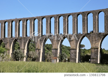 Exploring Pegoes Aqueduct in Portugal's serene landscape 130811706