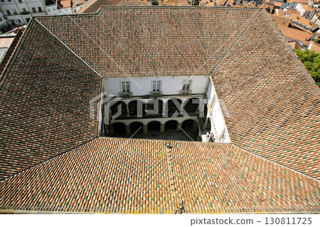 Rooftop view of historic architecture in Coimbra, Portugal with courtyard below Rooftop view of historic architecture in Coimbra, Portugal with courtyard below 130811725