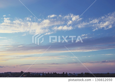 Beautiful sunset over the city. Beautiful sky with clouds. Nature composition. 130812050