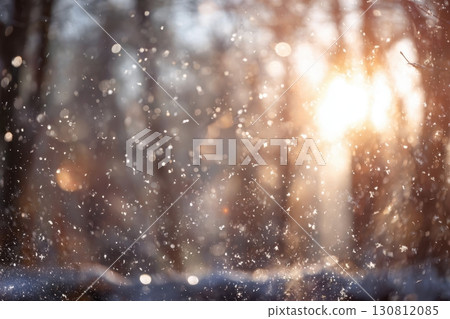 Blurred winter forest with falling snow. Snowfall many dust freeze granules. Blur bokeh snowy backdrop with pine trees. Christmas poster, banner. Dreamy, foggy blue purple sky, orange sun rays light 130812085