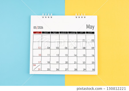 May 2026 calendar on blue and yellow color background, Flat lay. May 2026 calendar on blue and yellow color background, Flat lay. 130812221