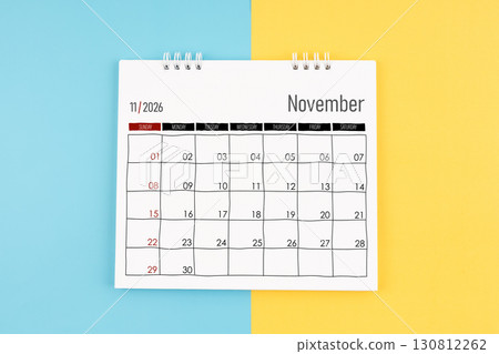 November 2026 calendar on blue and yellow color background, Flat lay. 130812262