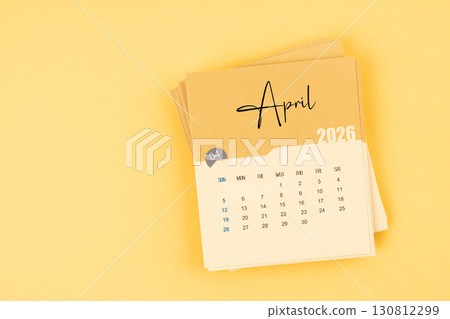 April 2026 calendar card on yellow color background with copy space. 130812299