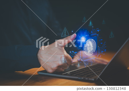 User log in using fingerprint authentication on laptop with warning icon, emphasizing secure login method. Cybersecurity and user identity protection. 130812348