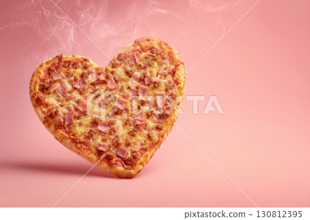 Heart shaped pizza on a pink color background. Hot Steamed Pizza Heart Shape with pepperoni and mozarella cheese. Card for Valentine's Day, Date or Anniversary. Food symbol of romantic love. 130812395