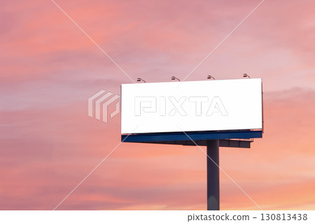 An empty mockup banner for advertising and design against a colorful sunset sky. A wonderful mockup background for a design presentation. An empty mockup banner for advertising and design against a colorful sunset sky. A wonderful mockup background for a design presentation. 130813438