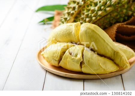 Durian fruit. Ripe monthong durian on sack and white wood background, king of fruit from Thailand on summer 130814102