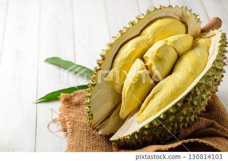 Durian fruit. Ripe monthong durian on sack and white wood background, king of fruit from Thailand on summer 130814103
