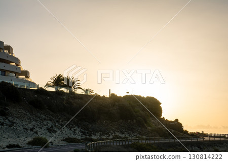 A dazzling sunrise rising from behind the coastal hills on Fuerteventura in the Canary Islands A dazzling sunrise rising from behind the coastal hills on Fuerteventura in the Canary Islands 130814222
