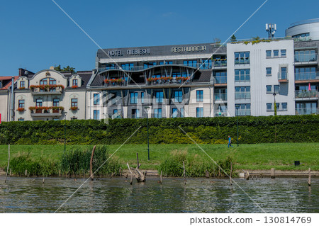 Poland, Krakow, View of the Niebieski Art Hotel from the Vistula River 130814769