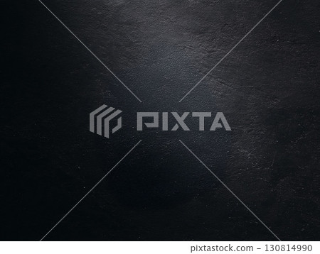 Dark, textured background with subtle light. Ideal for overlay, grunge, or industrial designs. Evokes depth and mystery, perfect for creative projects. 130814990