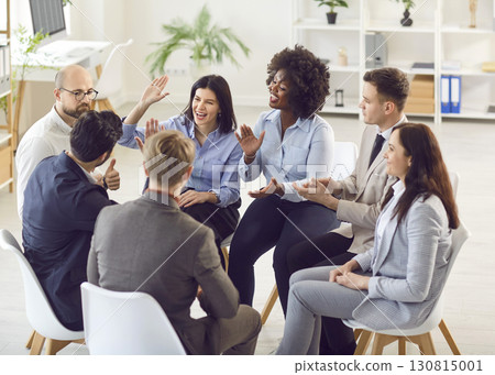 Business Team High Fiving During Office Meeting 130815001