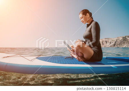 Woman Laptop Paddleboard Working Remotely on Sea Woman Laptop Paddleboard Working Remotely on Sea 130815114