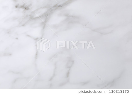Elegant marble texture, pristine white with delicate grey veining. Ideal for backgrounds, overlays, or design elements demanding a touch of sophisticated minimalism. 130815170