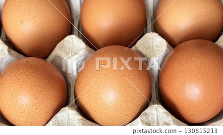 Eggs in paper tray, top view. Fresh farm eggs in eco packaging, organic food, healthy eating video concept Eggs in paper tray, top view. Fresh farm eggs in eco packaging, organic food, healthy eating video concept 130815213