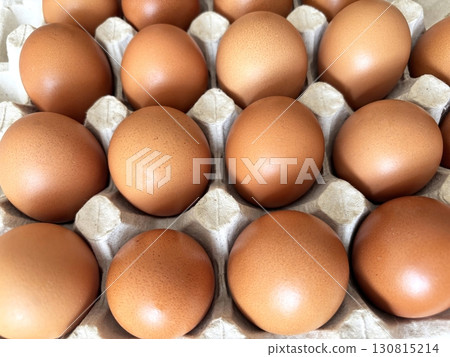 Eggs in paper tray, top view. Fresh farm eggs in eco packaging, organic food, healthy eating video concept Eggs in paper tray, top view. Fresh farm eggs in eco packaging, organic food, healthy eating video concept 130815214