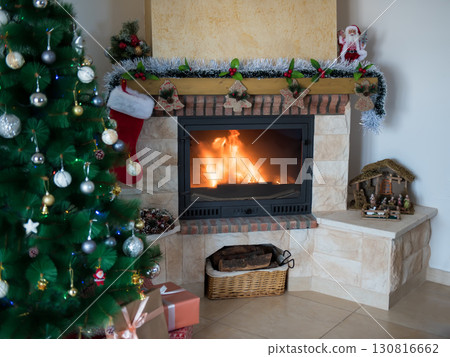 New Year's background with a fireplace and a Christmas tree. Festive mood New Year's background with a fireplace and a Christmas tree. Festive mood 130816662