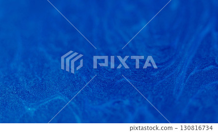 Shiny oil. Blend flow. Defocused blue colorful ink water marble sparks liquid texture enamel fluid moving on abstract art background. 130816734