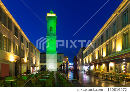Night view of Nimes streets and building illuminated at dusk 130816972
