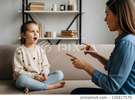 Neurodivergent kid girl in speech therapy practicing articulation with therapist guidance to improve pronunciation communication and autism spectrum inclusion awareness 130817576