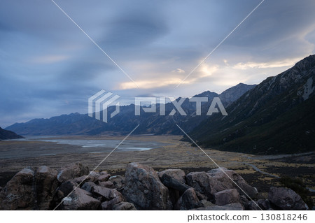 Colorful sunset over alpine valley framed by mountains, New Zealand Colorful sunset over alpine valley framed by mountains, New Zealand 130818246