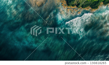 Aerial view turquoise blue ocean waves crashing rocky coastline green cliffs 130818265