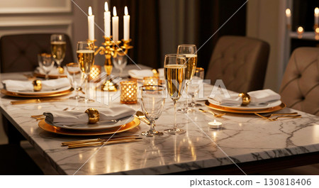 A luxurious and elegant dinner table setting with champagne glasses, gold tableware, and lit candles, perfect for a festive and romantic celebration 130818406