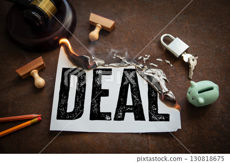 Burning canceled business deal with broken agreement symbolism 130818675