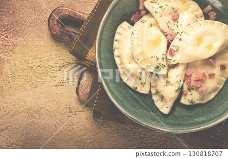 Dumplings, with fried prosciutto, a traditional dish of Polish cuisine, dumplings, top view, close-up, without people, 130818707
