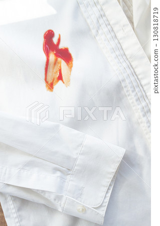 White shirt stained with ketchup, no people, close-up , selective focus, 130818719