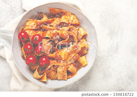 pappardelle pasta with bolognese sauce, topped with parmesan cheese and cherry branch, homemade, no people, 130818722